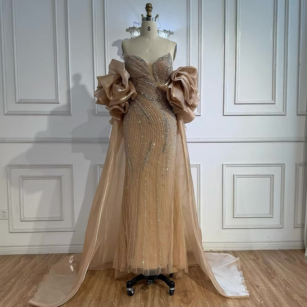 فستان فاخر مطرز مع كايب للمسه أنيقة