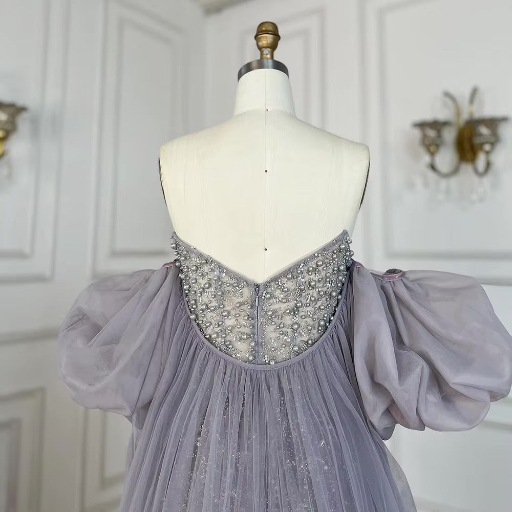 فستان فاخر مزين بالكريستال والؤلؤ يلمسه أنثويه